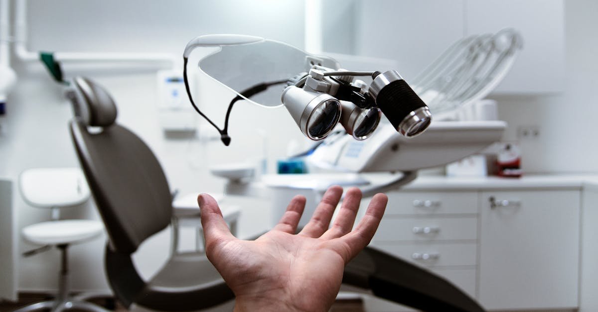 Floating dental loupes in a modern, clean dentist office setting.